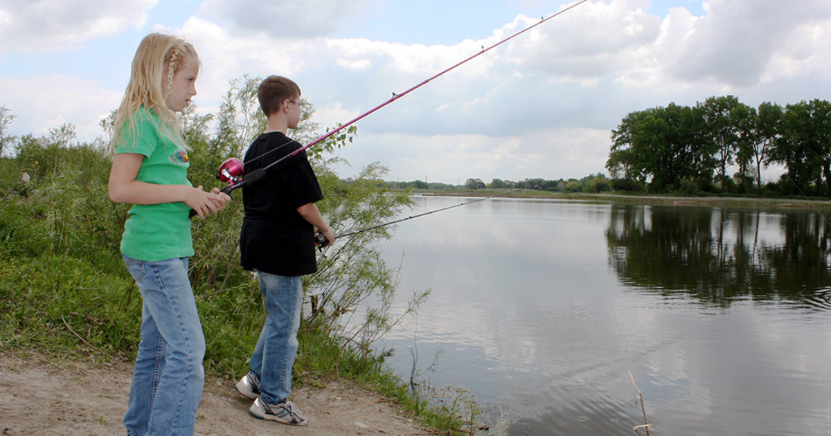 Family fishing on the pond